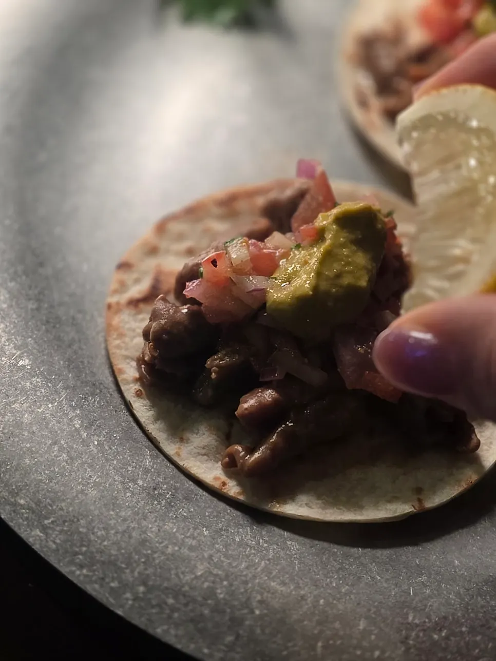 Tripe tacos served with lemon