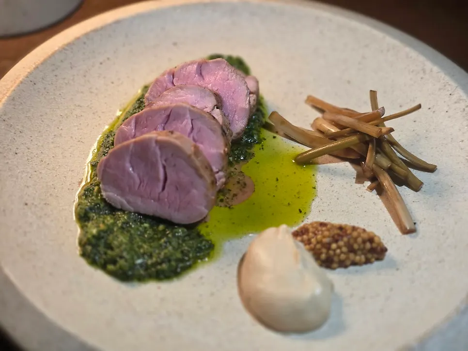 Pork tenderloin steak over basil pesto