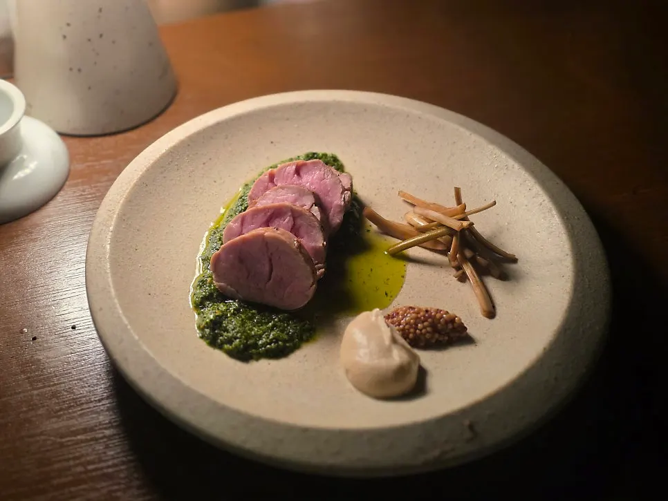 Steak served with garnish and whole-grain mustard