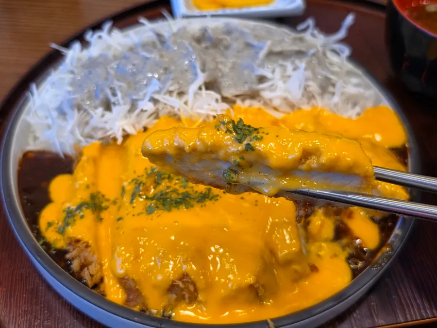 Close-up cross-section of the spicy cheddar tonkatsu