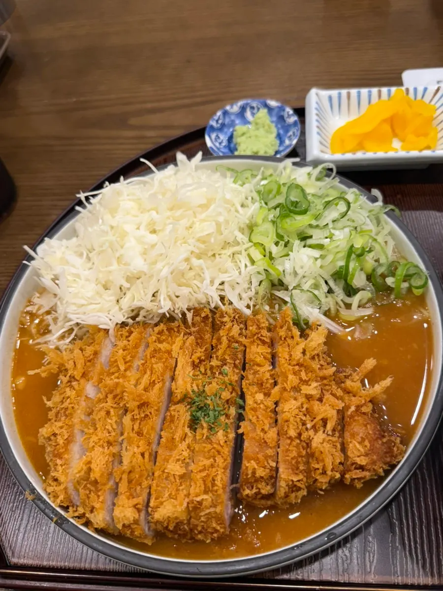 Close-up of cheddar cheese tonkatsu with spicy sauce