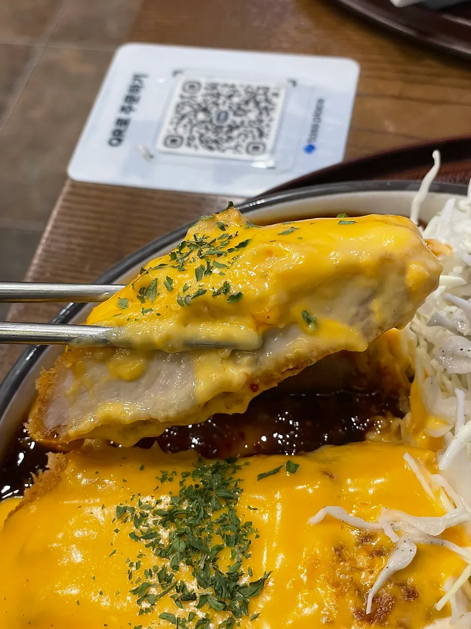 Cross-section of the thick spicy cheddar tonkatsu