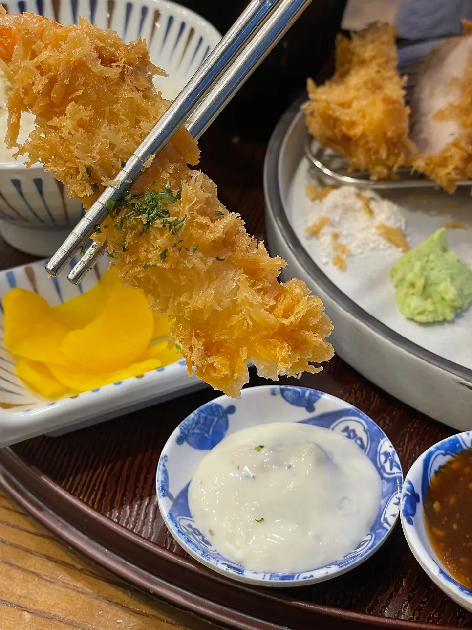 Shrimp tempura dipped in tartar sauce