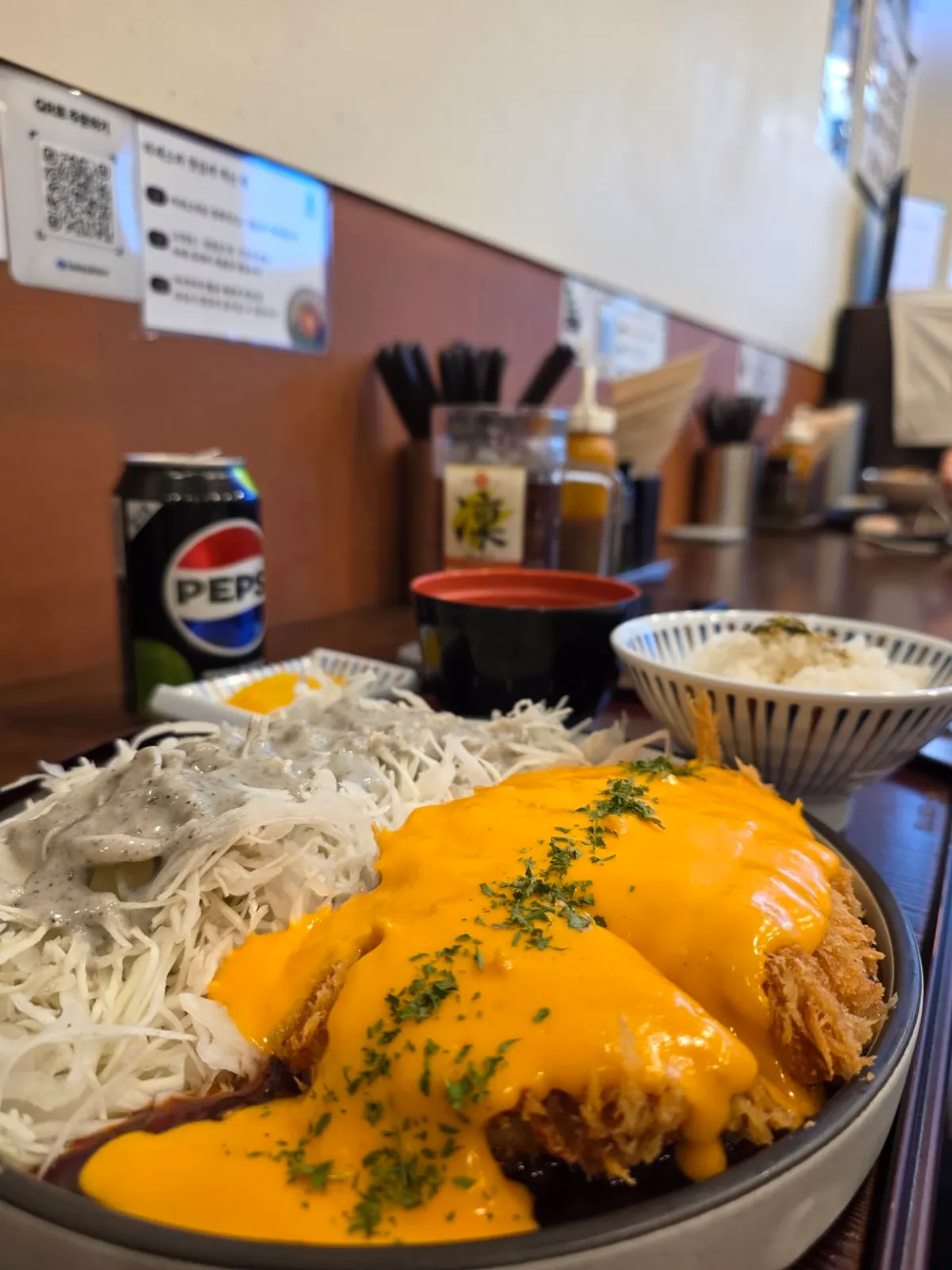 Spicy cheddar tonkatsu piled high with cheese