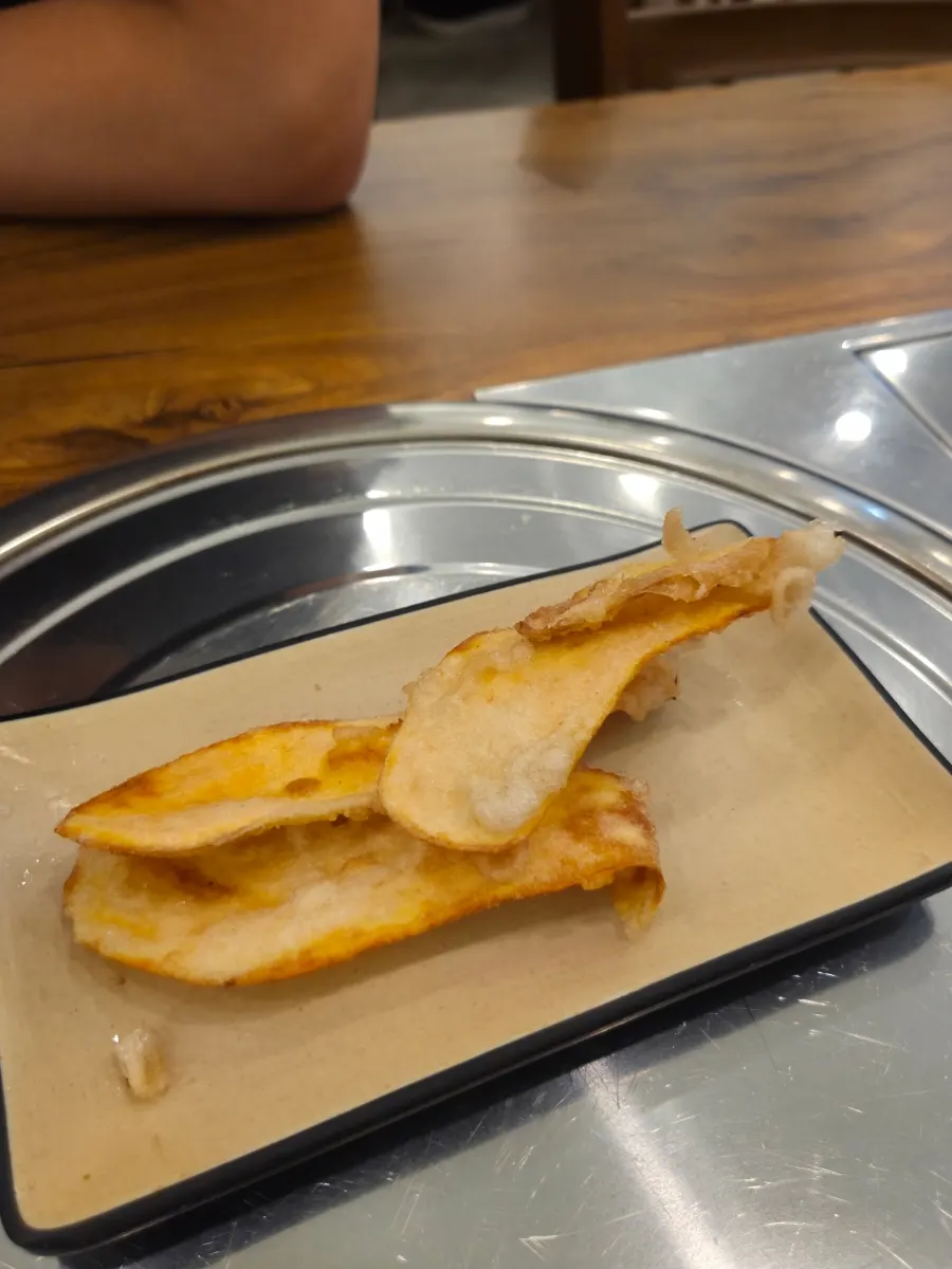 Thin crispy sweet potato fritters served with the tangsuyuk