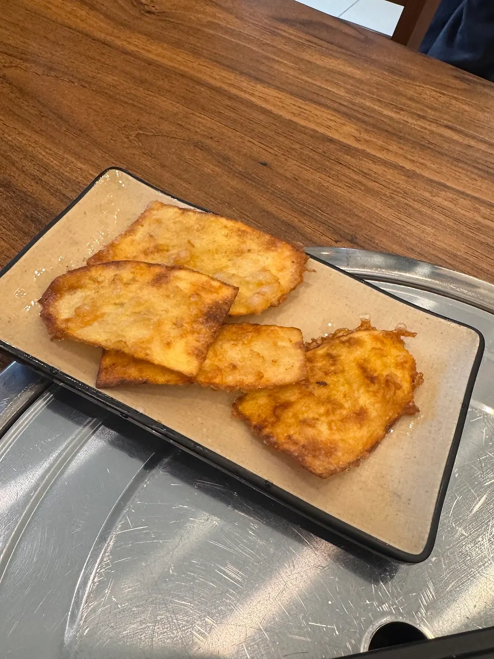 Complimentary sweet potato fritters served at the table