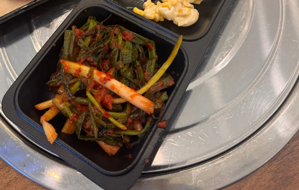 Chinese meal spread with scallion kimchi on the side