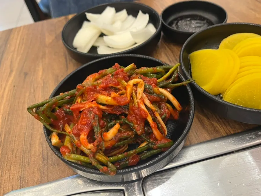 Self-serve bar with pickled radish and kimchi