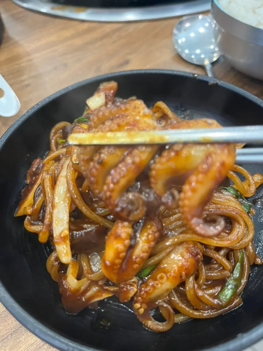 Close-up of plump jjukkumi in the stone jjajang