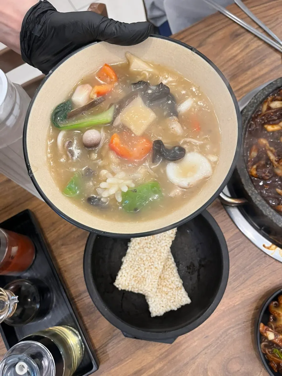 Crispy scorched rice before the sauce is poured on