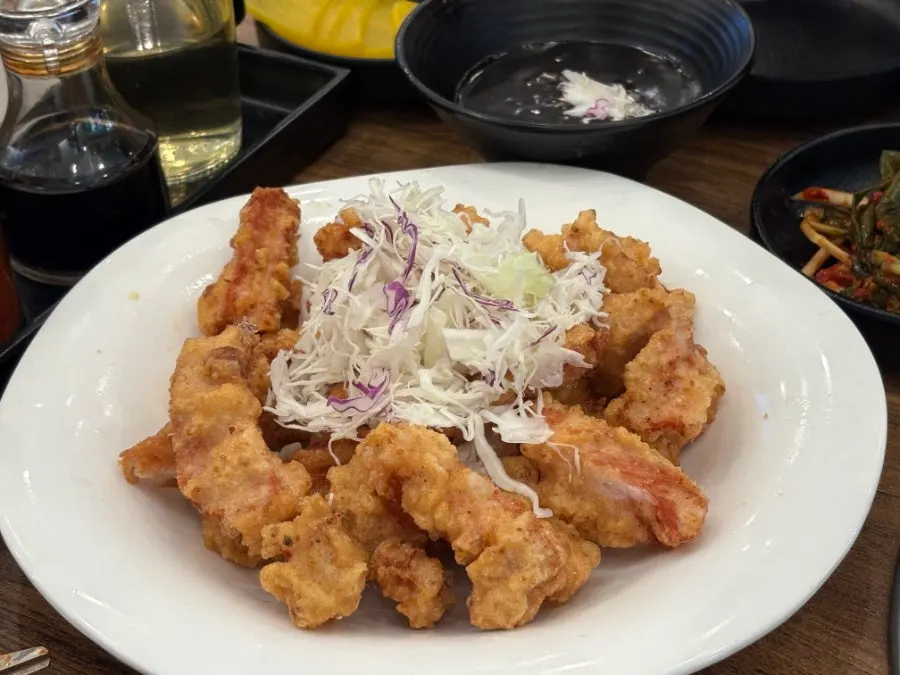 Dip-style tangsuyuk topped with cabbage