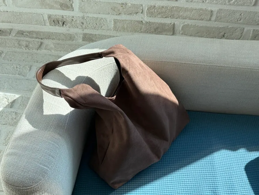Meda Bag suede shoulder bag holding everyday essentials