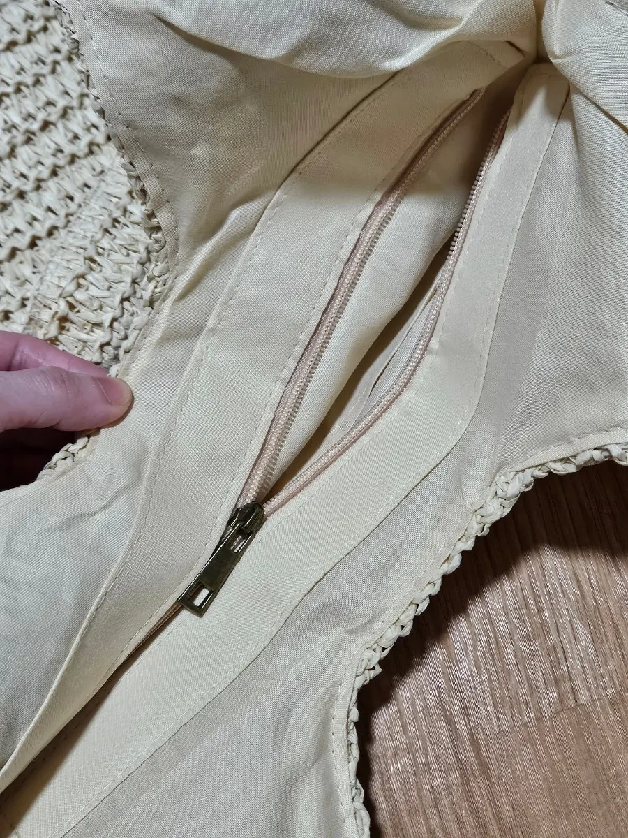 Rattan shoulder bag showing its storage space