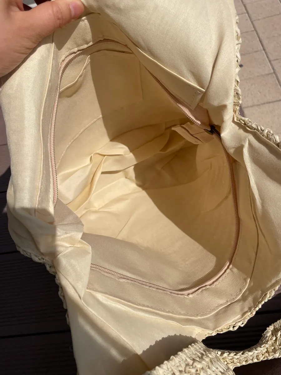 Storage section of the beige Meda Bag rattan bag