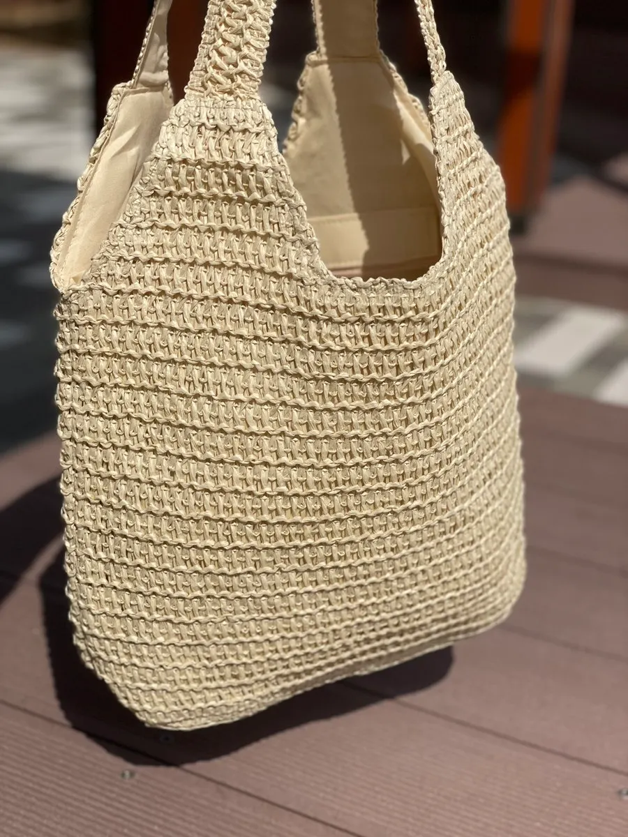 Roomy storage layout of the Meda Bag rattan bag