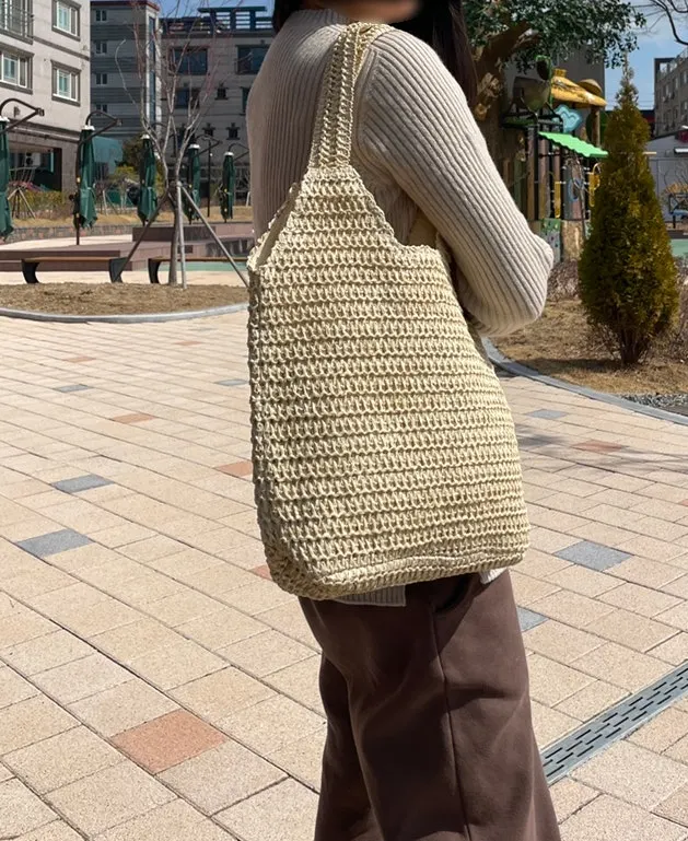 Wearing the large Meda Bag rattan bag