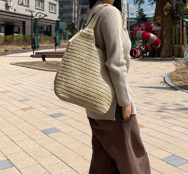 Beige rattan bag styled with an everyday outfit