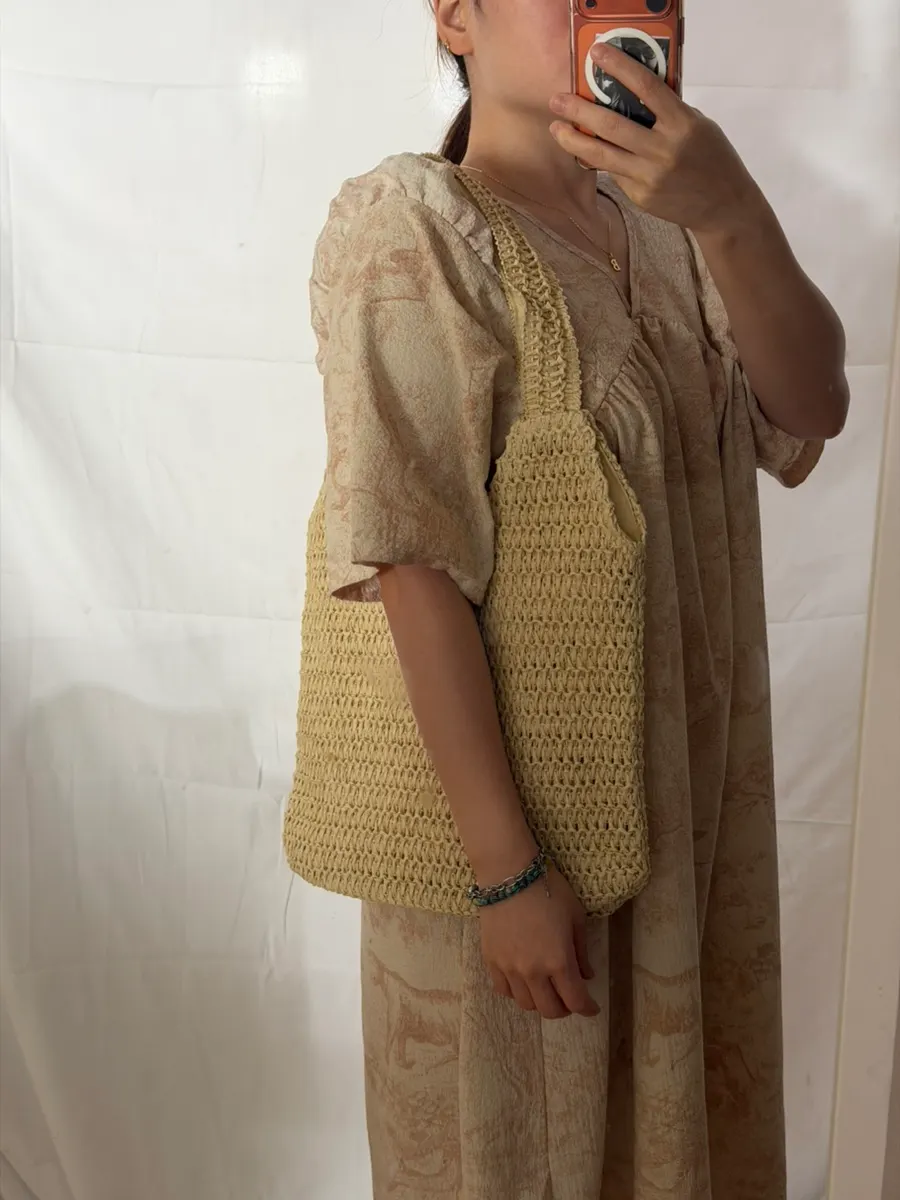 Meda Bag rattan bag worn as a shoulder bag