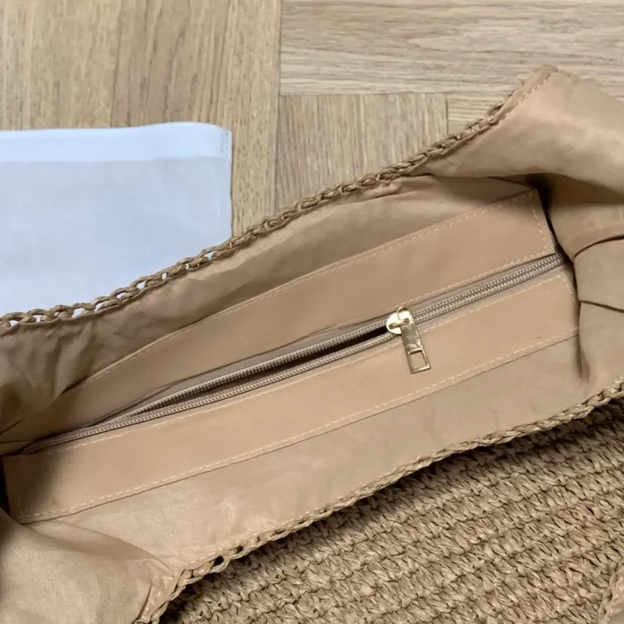 Close-up of the lined handle on the Meda Bag rattan bag