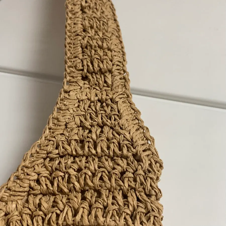 Meda Bag rattan shoulder bag with a Pochacco keychain
