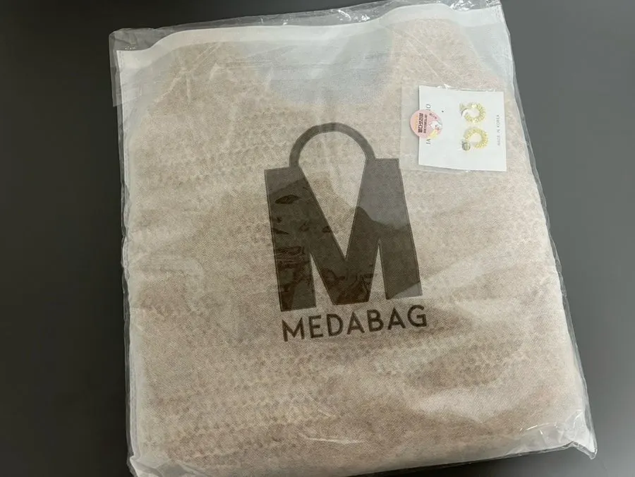 Meda Bag rattan shoulder bag chosen for a resort trip