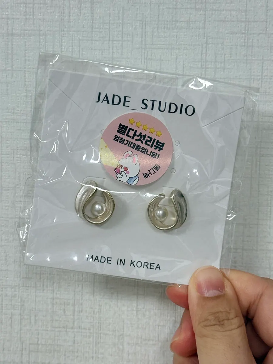 Earrings included with the Meda Bag rattan bag