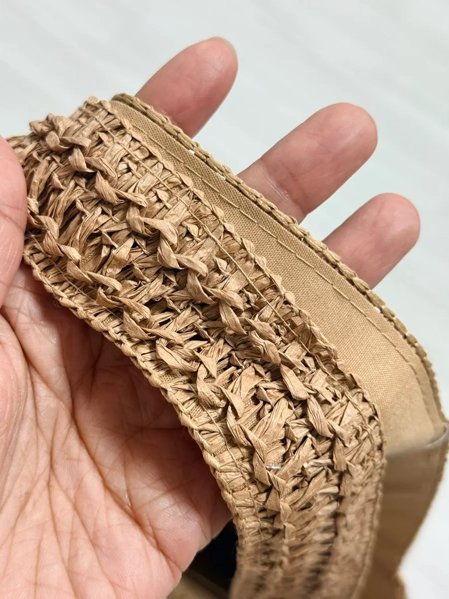 Strap of the Meda Bag rattan bag worn over the shoulder
