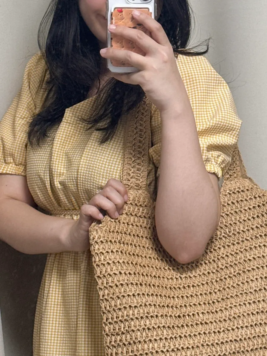 Brown Meda Bag paired with a summer dress