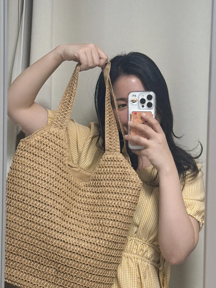 Brown Meda Bag rattan bag paired with a dress