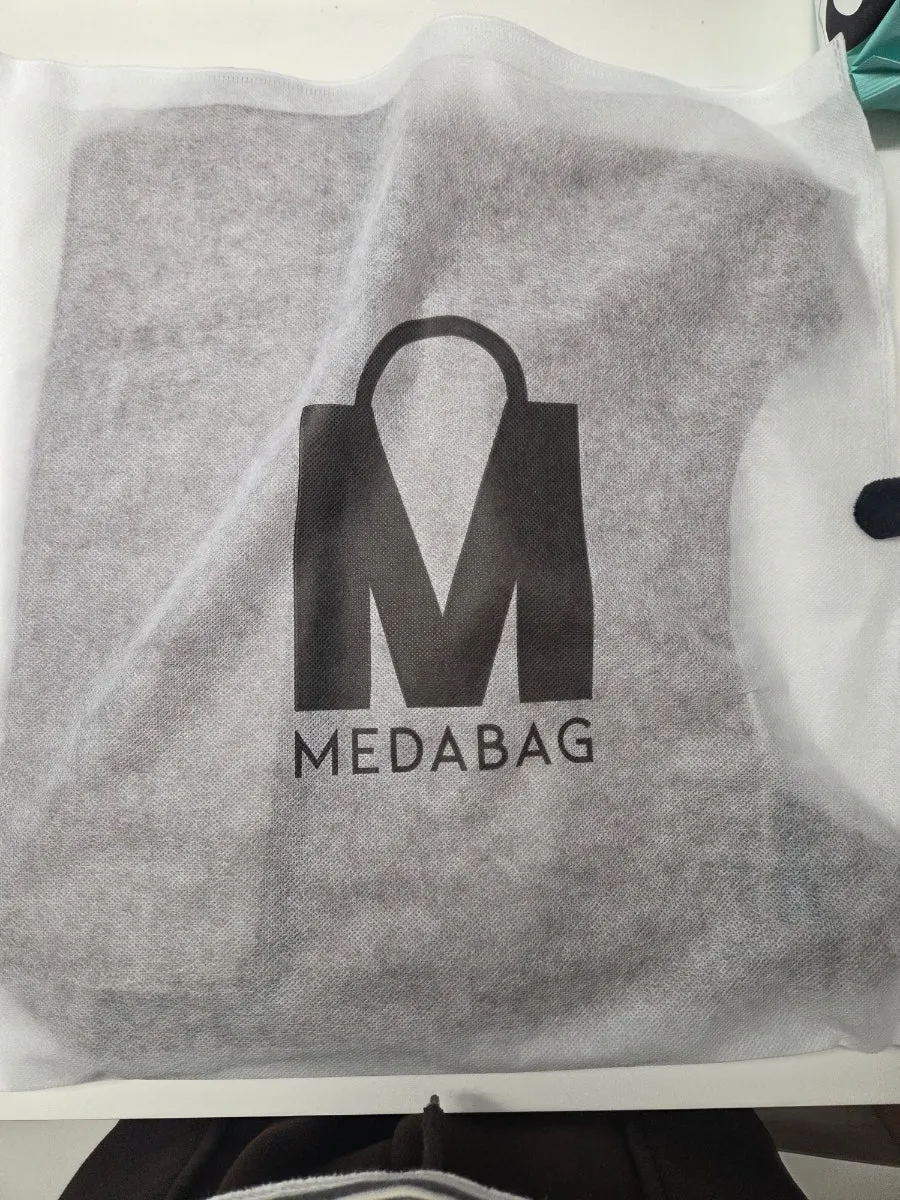 Soft faux suede material of the Meda Bag shoulder bag