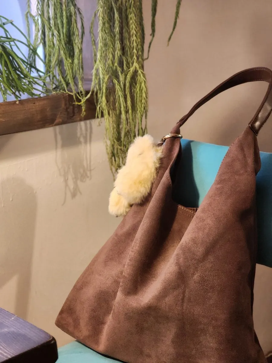 Shape and shoulder strap of the Meda Bag Suede Shoulder Bag