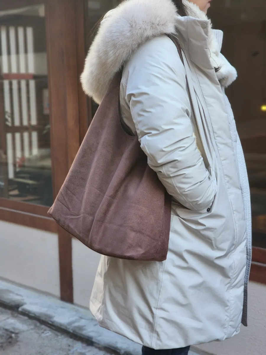 Generously sized pouch in the same color as the Meda Bag shoulder bag