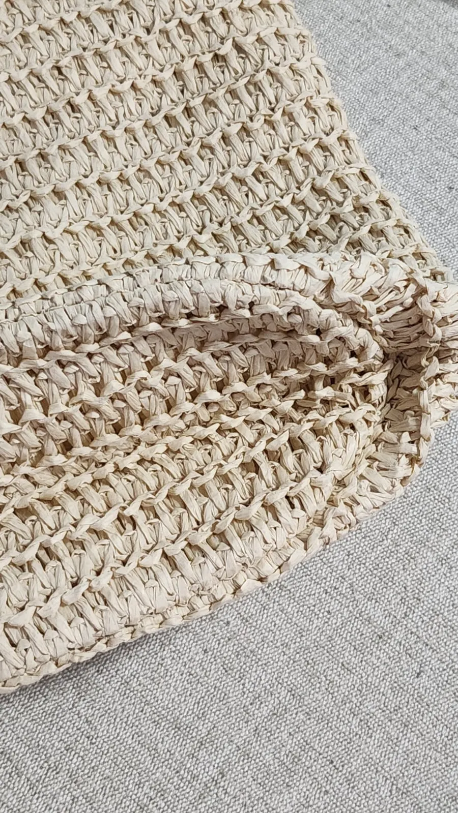 Inside the Meda Bag rattan bag with an inner pouch and zipper