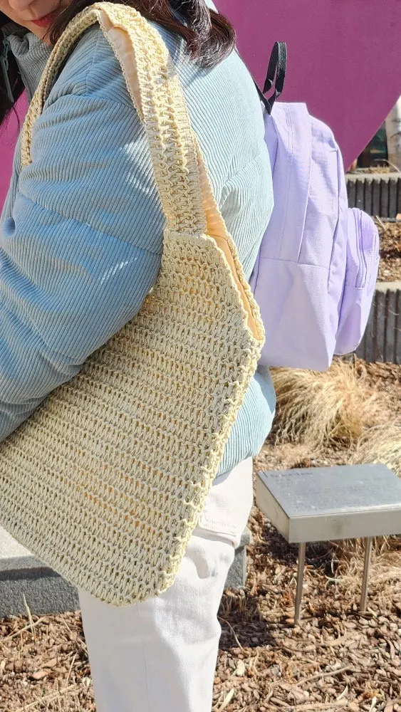 Ivory rattan bag styled with a basic outfit