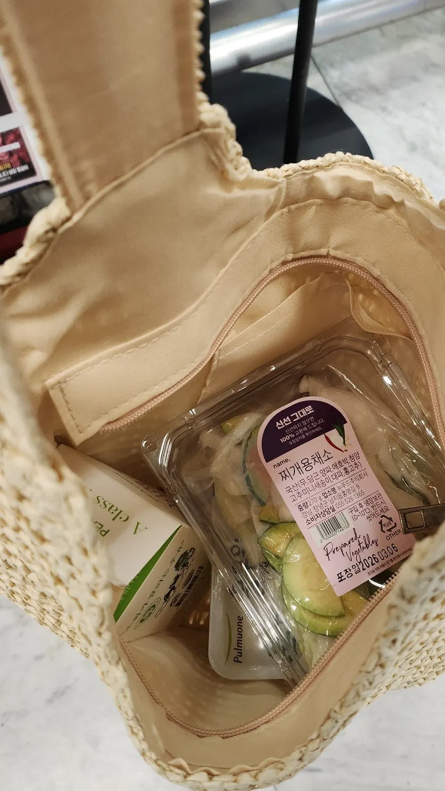 Meda Bag rattan bag holding milk, tofu, and vegetables