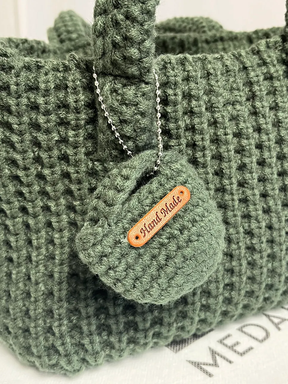 Muted green crochet bag