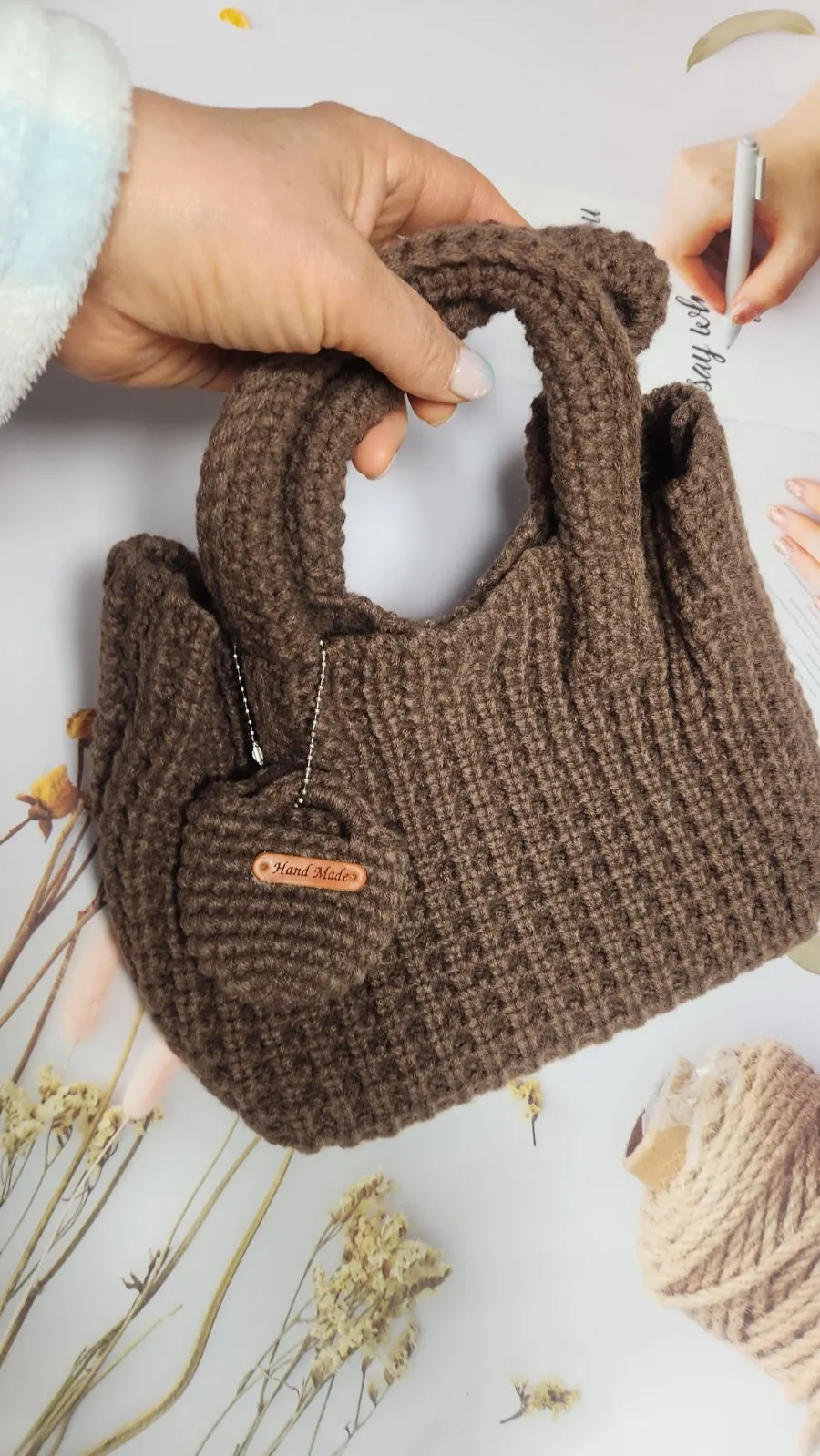 Holding the mini tote bag