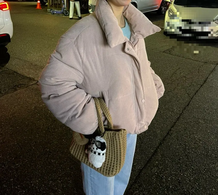 Knit tote bag carried with a winter outfit