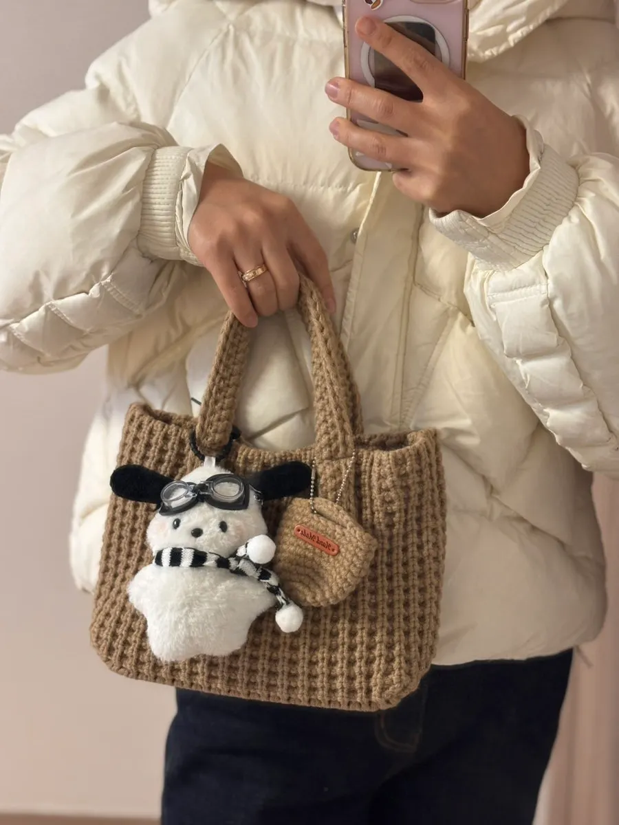 Knit tote bag with a character doll attached