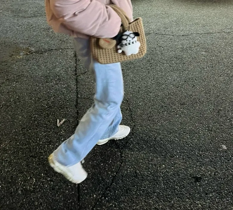 Mini knit tote bag held in one hand