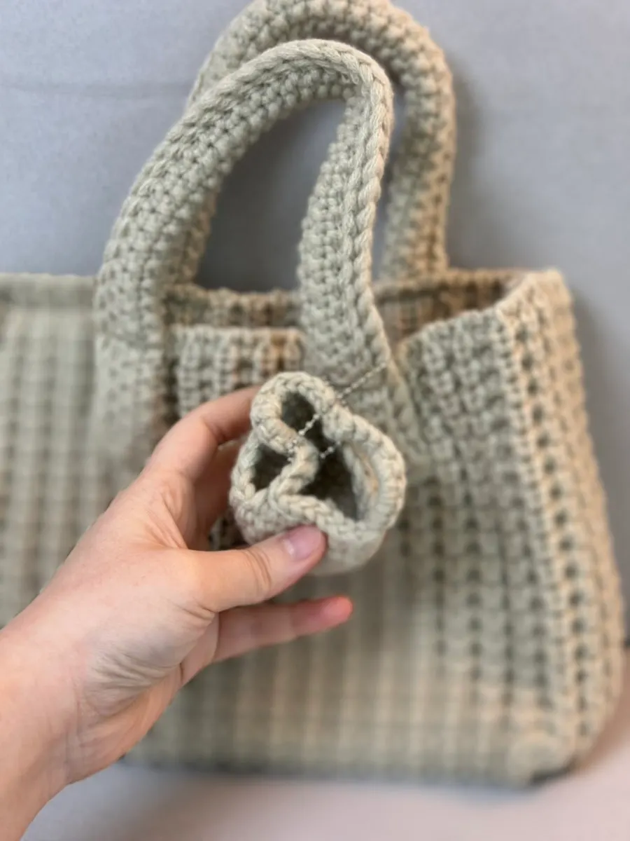 Knit mini tote bag holding its shape