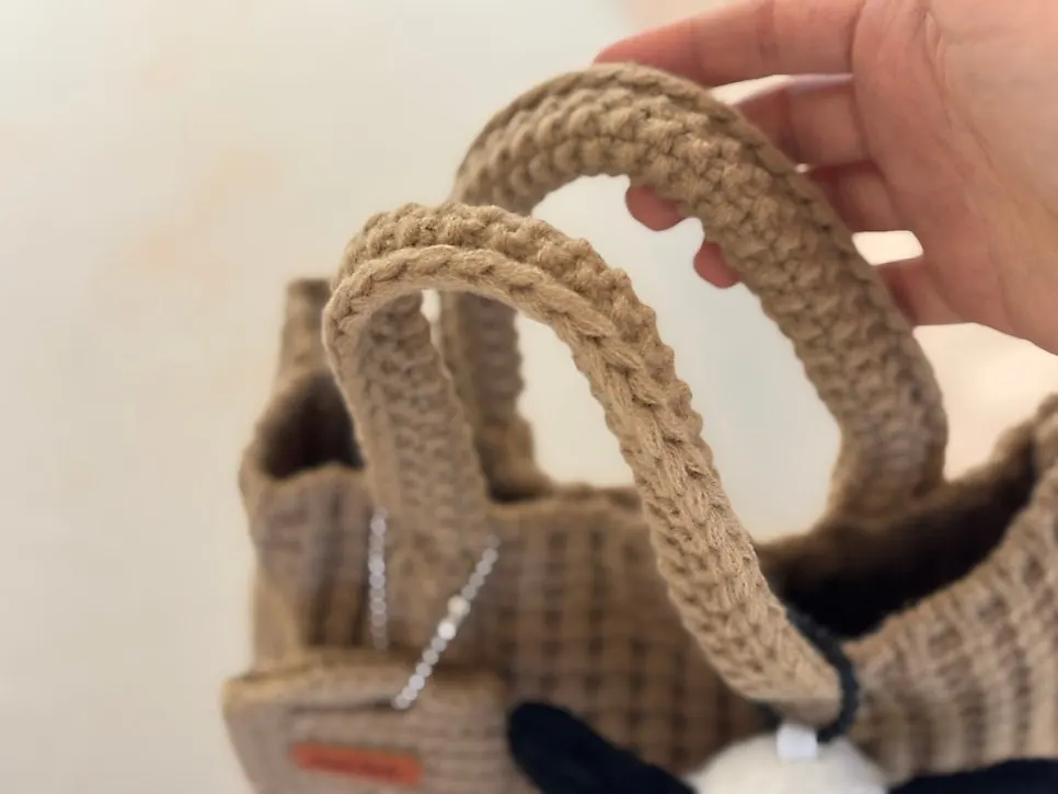 Beige knit tote bag carried daily