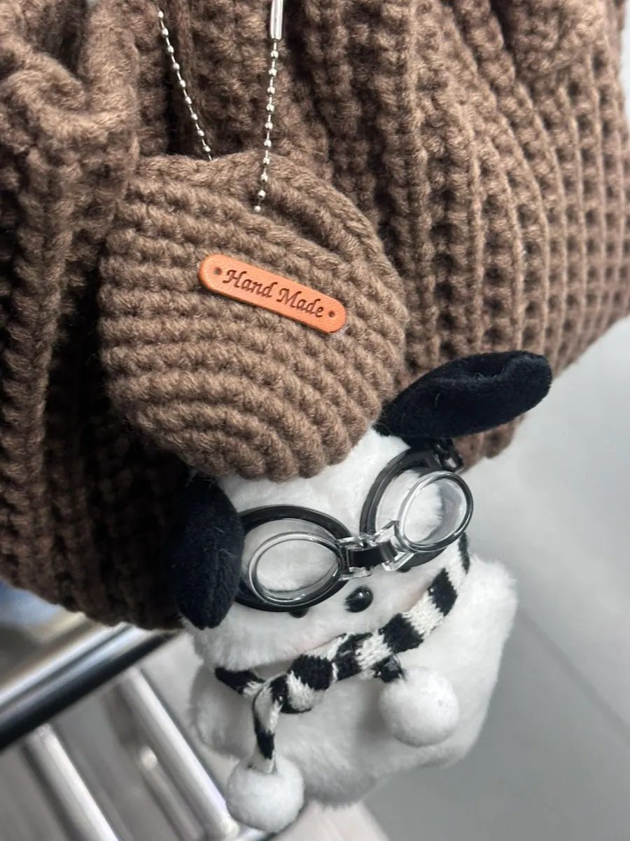 Knit tote bag carrying personal items