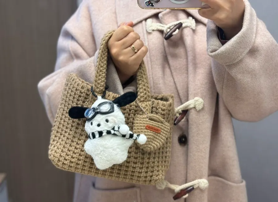 Front and back views of the knit tote bag when carried