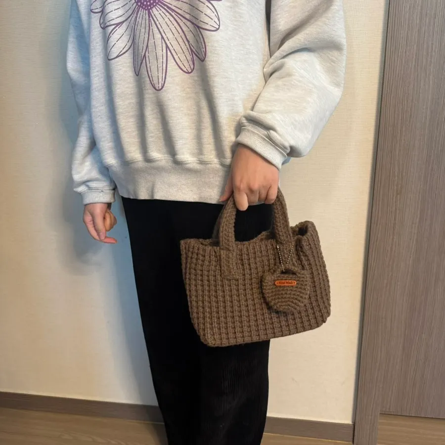 Meda Bag Knit Bag filled with personal items