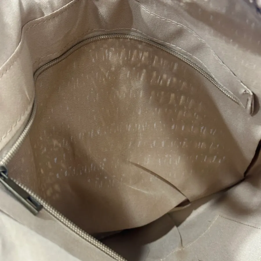 Interior storage space of the Meda Bag rattan shoulder bag