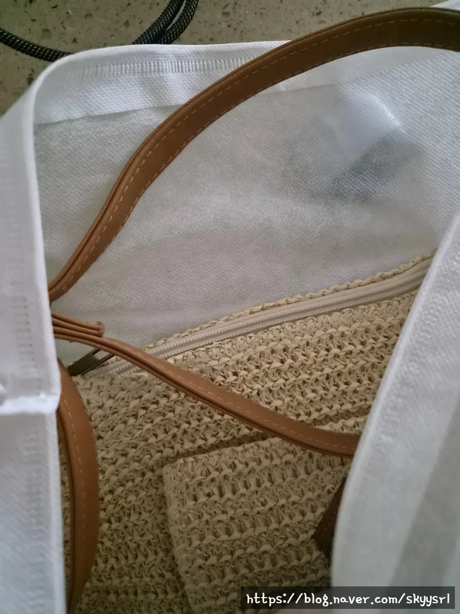 Meda Bag rattan bag accented with a keyring