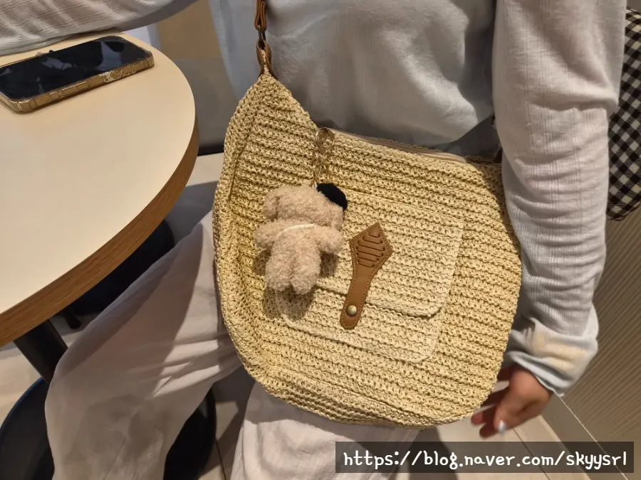 Meda Bag rattan bag shown with its care instructions