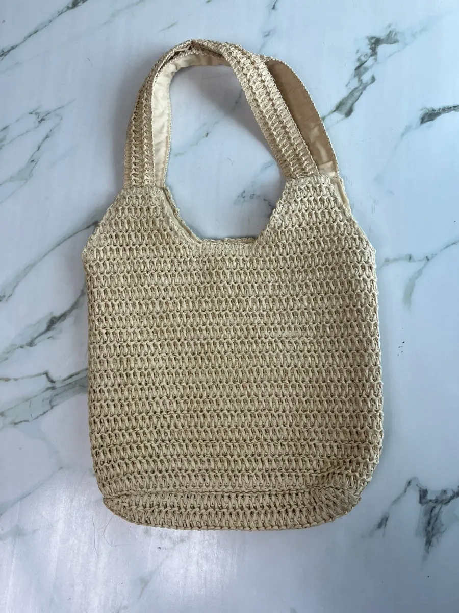 Rattan bag prepared for outfits at a warm travel destination