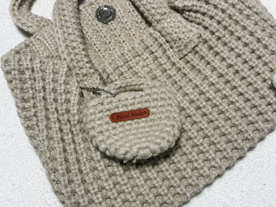 Ivory knit dot bag worn